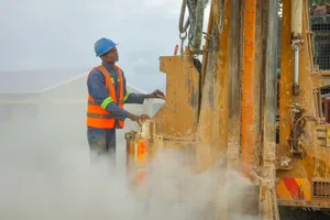 Drilling crew reviewing morning reports at a remote rig site