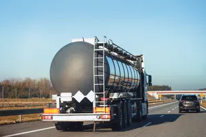 Tanker truck on highway hauling fluids between oilfield locations