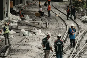 Rail infrastructure construction showing track installation and ballast placement