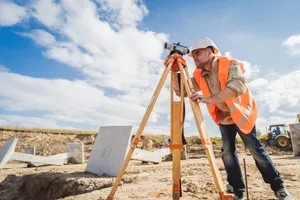 Survey crew deploying equipment in the field for a land surveying project