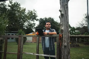 Field worker waiting for ticket approval at well site