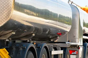 Water hauling trucks loading at a produced water battery