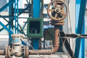 Well service equipment and vehicles staged at an oilfield location